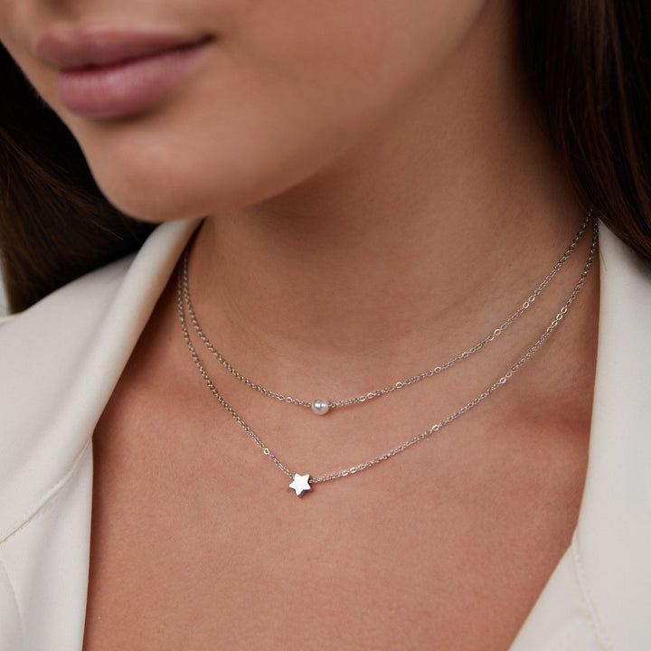 Collar en capas – Estrella de plata y perla elegante