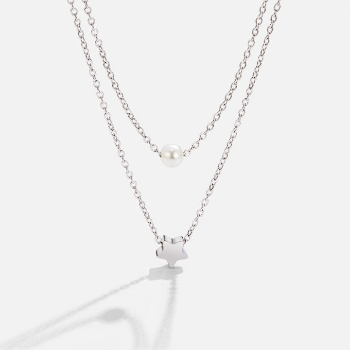 Collar en capas – Estrella de plata y perla elegante