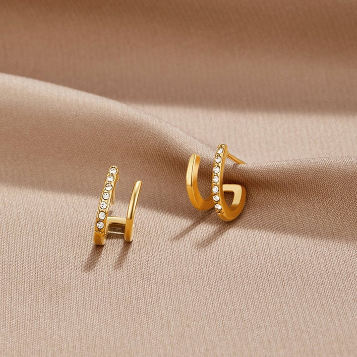 Pendientes garra – Oro y cristales brillantes